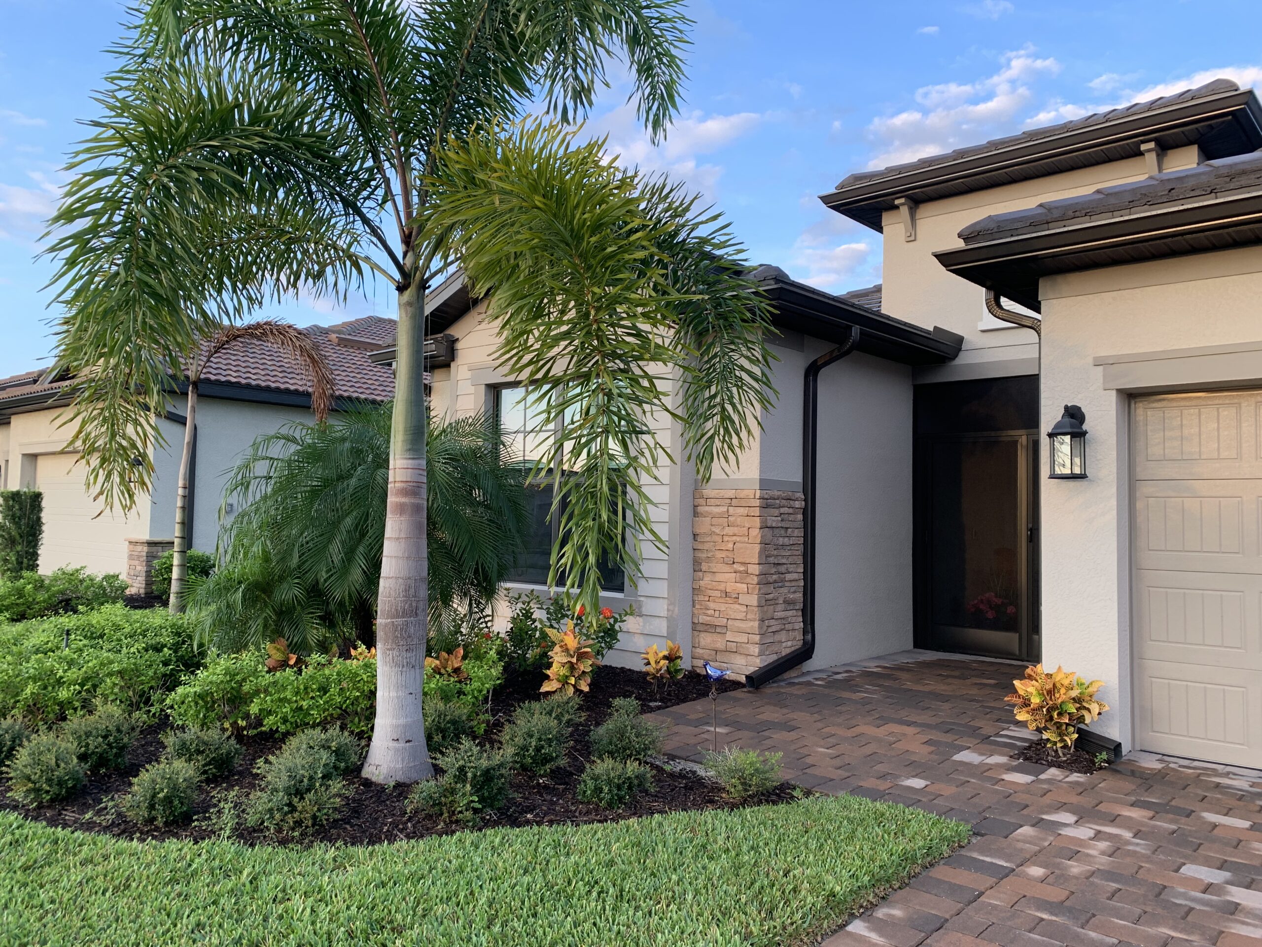 Summerville II model home with palm tree in Estero, FL