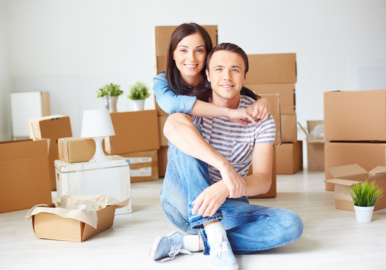 new homeowners enjoy new home while surrounded by boxes